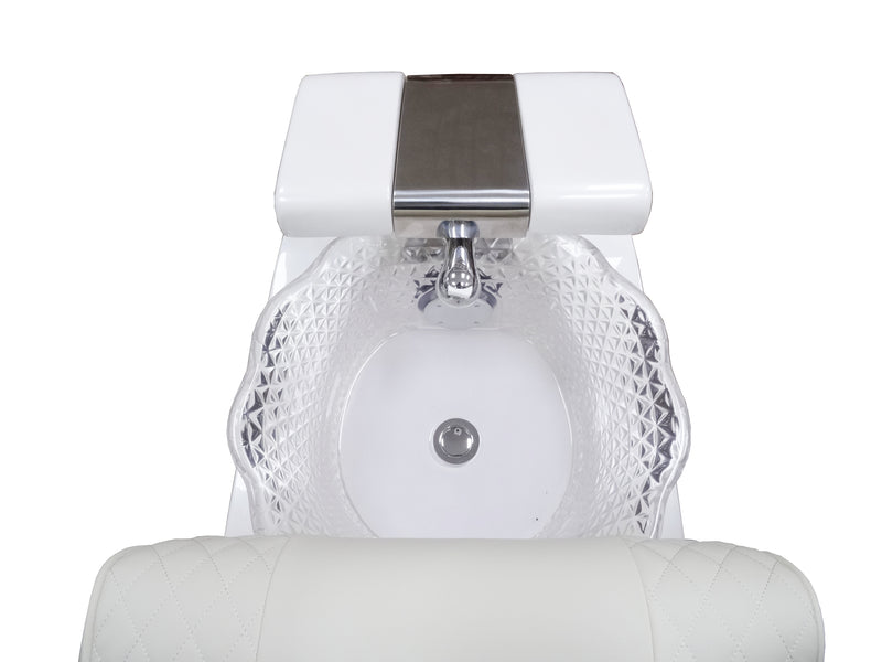 White sink with textured basin and metallic faucet on a white background